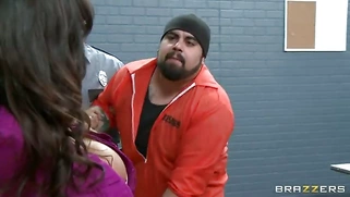 Lisa Ann teases the prisoners with her enormous tits and slutty attire