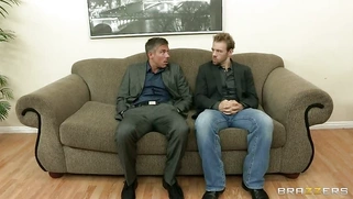 JR Carrington shows off her fake boobs and titfucks two dicks