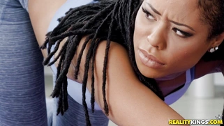 Brett Rossi, Kira Noir and Justin Hunt do yoga exercises