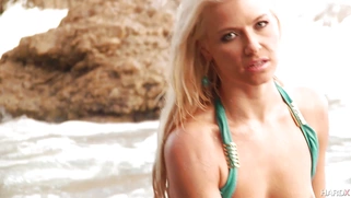 Outstanding babe Anikka Albrite posing on the beach