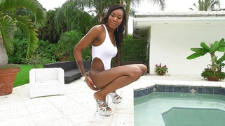 Nadia Jay in a white leotard showed us her booty and took a dip in the pool