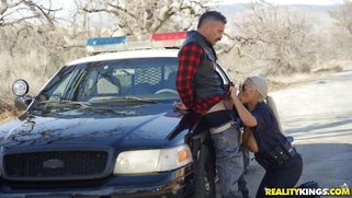 Cop Bridgette B is sucking cock outdoors
