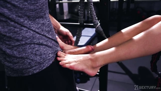 Teen Mia Split guzzles the cock and licks balls in the gym