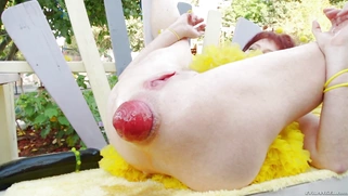 Amber Rayne sucks the apple-sized rectal knot protruding from Donna Flower's ass