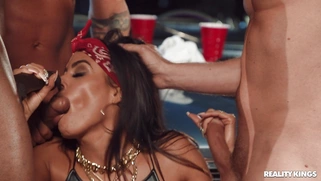 Luna Star is sucking three big cocks outdoors