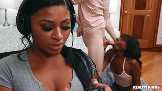 Amari Anne on her knees is sucking Alex Jett's cock