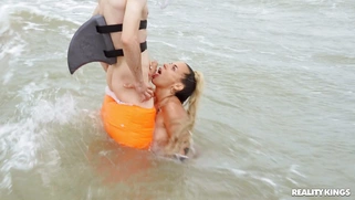 Lola Emme is sucking Jordi's cock in the ocean