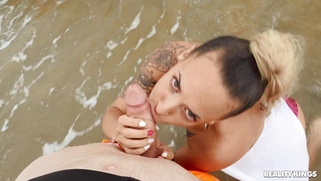 Lola Emme is sucking Jordi's cock in the ocean