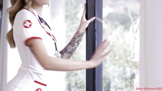 Charlotte Sins is posing in sexy nurse uniform