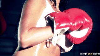 Boxer girl Aryana Augustine hitting the bag in the gym
