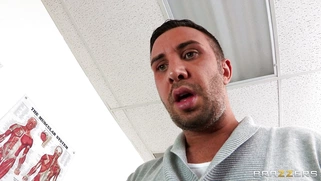 Dana Vespoli in a glasses maintains eyecontact while blowing