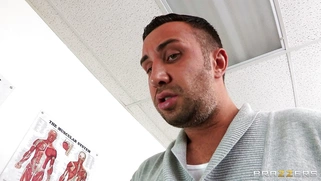 Dana Vespoli in a glasses maintains eyecontact while blowing