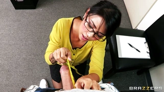 Dana Vespoli in a glasses maintains eyecontact while blowing