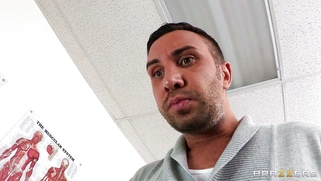 Dana Vespoli in a glasses maintains eyecontact while blowing