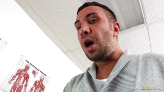 Dana Vespoli in a glasses maintains eyecontact while blowing