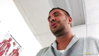 Dana Vespoli in a glasses maintains eyecontact while blowing