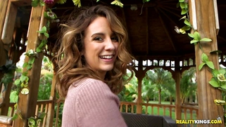 Layla London poses, wearing short dress, stockings and high heels