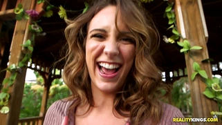 Layla London poses, wearing short dress, stockings and high heels