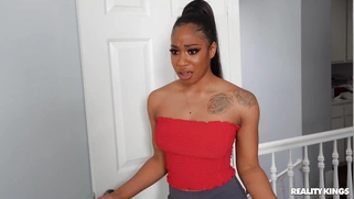 Ebony Lala Ivey on her knees is sucking the white cock