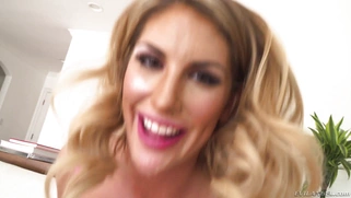 August Ames blows huge cock and treats to a spit-lubed titty fuck