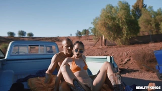 Lilly Bell in sunglasses rides the hard rod with her trimmed twat