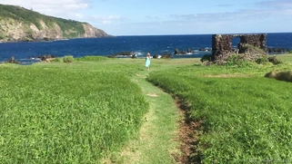 Gorgeous blonde Anikka Albrite posing among cloud-shrouded mountains