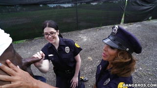 Cock hungry cops Lyla Lali and Norah Gold sucking giant black pole