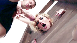 Kate England sucks monster cock in the pillory