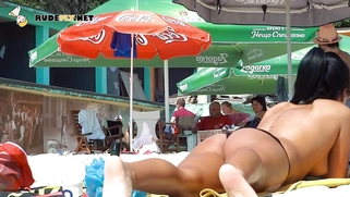 Pretty nudist teen enjoys her summer topless outdoors