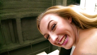 Slender doll Alexa Grace posing in high heels and blue dress