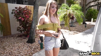 Alexa Kiss is getting picked up outdoors