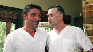 Two masseurs rub Jewels Jade's muscle body and finger her cunt