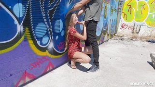 Mary Popiense is sucking Alberto Blanco's cock outdoors