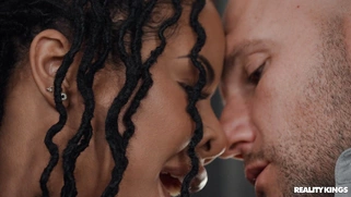 Ebony Kira Noir is sucking big white cock