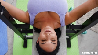 Anissa Kate is sucking Jordi's cock on the gym bench