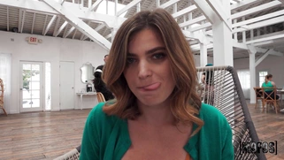 Nicole Rae is fingering her trimmed pussy on the chair