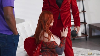 Abigaiil Morris on her knees is sucking black and white cocks