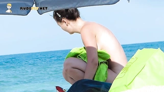 Fresh young nudist chicks caught on a voyeur camera