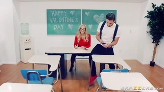 Brandi Love grades papers and rides her dildo at the same time