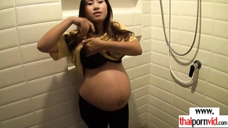 Amateur Thai pregnant Pat giving handjob