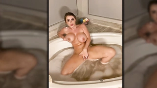 Sexy MILF taking a bath and masturbating