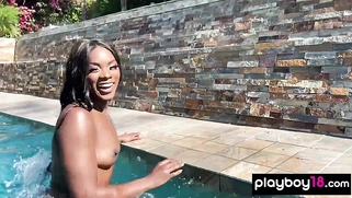 Naked ebony MILF fingers her hairy pussy