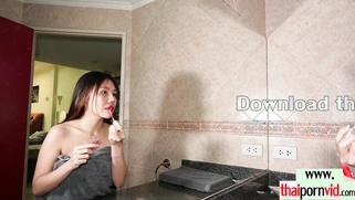 Restless Thai teen caressing her pussy