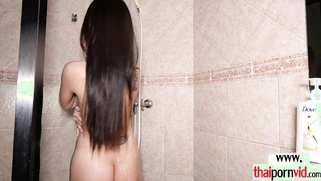 Restless Thai teen caressing her pussy