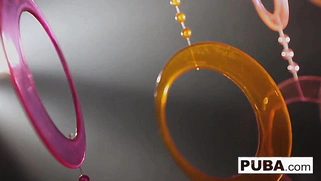 A pair of attractive women with a 70s vibe make each other cum