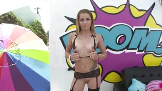 Alana Summers in sexy stockings posing outdoors