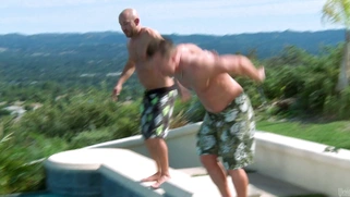 Samantha Saint stroking two dicks underwater