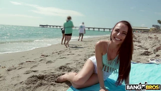 Redhead Aidra Fox has fun on the beach