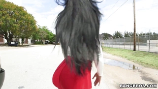 Kiara Mia in a red tight shorts showing off that big booty