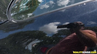 Marilyn Mansion flashes her big natural tits in the car